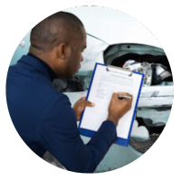 Insurance Loss Adjuster Checking Vehicle