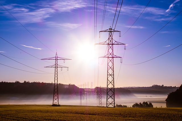 How to save energy in business, pylon, cables, sunrise, energy consumption